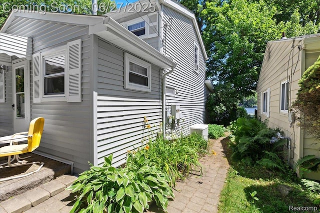 1500 Clark Lake Rd, Brighton, MI 48114 - view of side of property featuring a central air condition unit