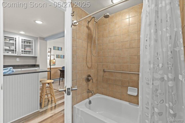 1500 Clark Lake Rd, Brighton, MI 48114 - full bath featuring shower / bath combo, wood finished floors, and recessed lighting