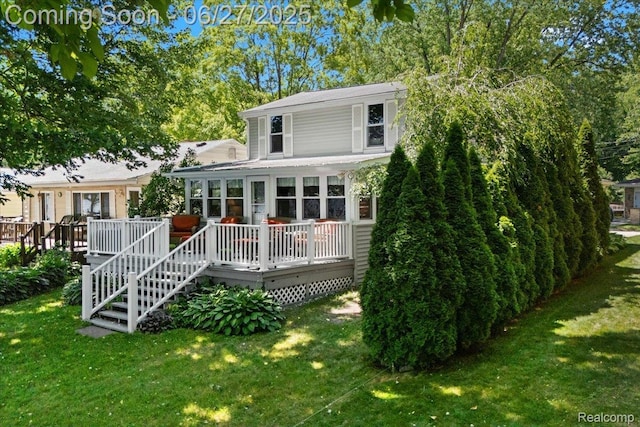1500 Clark Lake Rd, Brighton, MI 48114 - rear view of property featuring a lawn and a deck