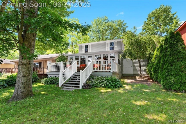 1500 Clark Lake Rd, Brighton, MI 48114 - rear view of house with a wooden deck, a yard, and stairway