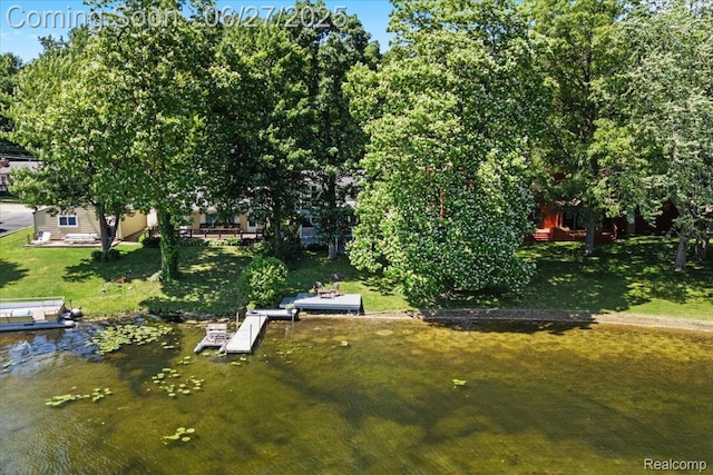 1500 Clark Lake Rd, Brighton, MI 48114 - view of green lawn featuring a floating dock and a water view