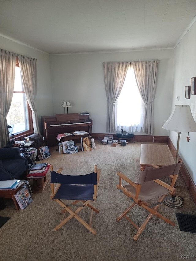 526 Comstock St, Adrian, MI 49221 - carpeted living room with plenty of natural light and ornamental molding