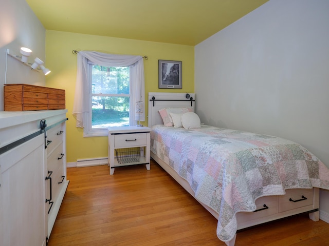 2805 Winchell Ave, Kalamazoo, MI 49008 - bedroom featuring light wood-style floors and baseboard heating