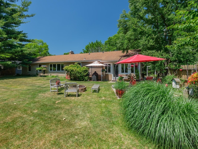 2805 Winchell Ave, Kalamazoo, MI 49008 - back of property featuring a gazebo, an outdoor fire pit, and a chimney