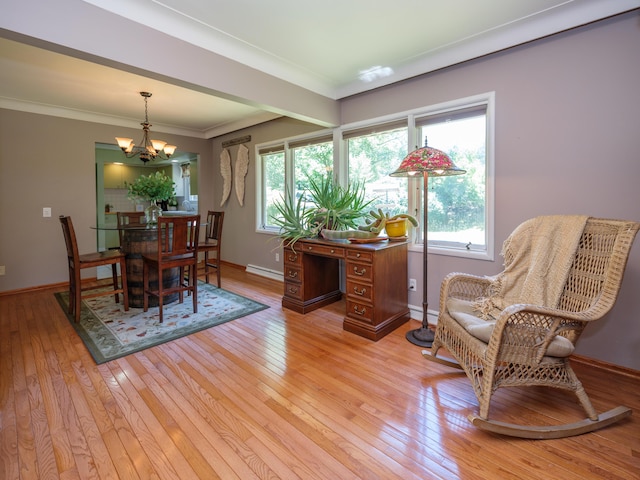 2805 Winchell Ave, Kalamazoo, MI 49008 - dining area featuring a chandelier, a baseboard heating unit, light wood-type flooring, plenty of natural light, and crown molding
