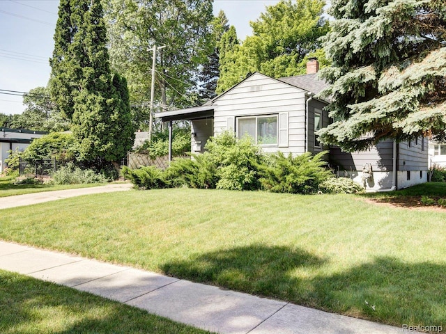 3107 Stone St, Port Huron, MI 48060 - view of front facade featuring a front lawn and a chimney
