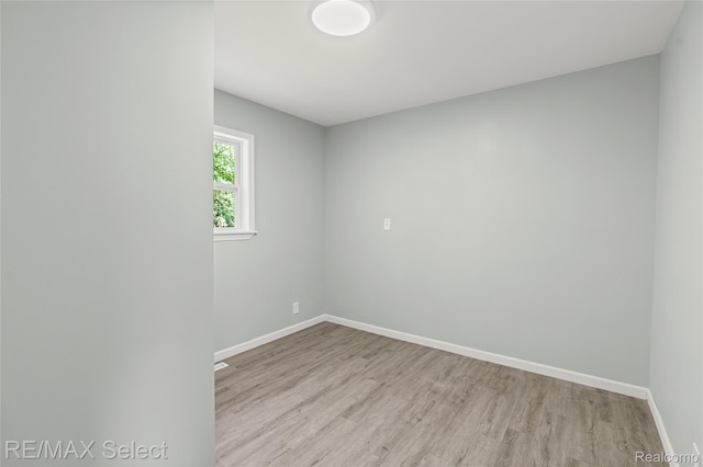 1413 Martha Ave, Burton, MI 48509 - spare room featuring wood finished floors