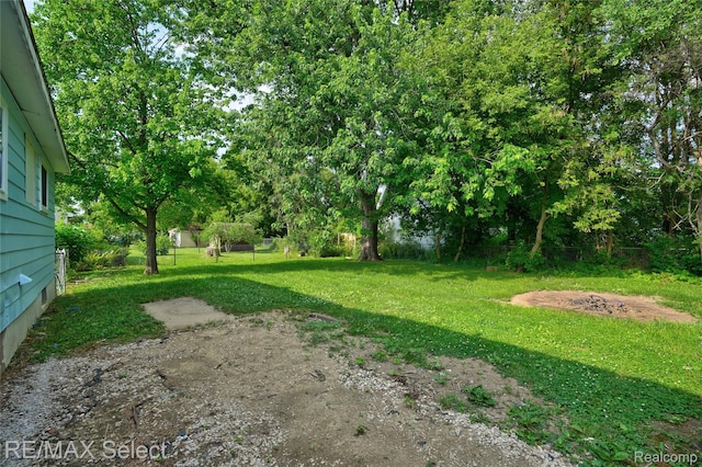 1413 Martha Ave, Burton, MI 48509 - view of green lawn with view of scattered trees
