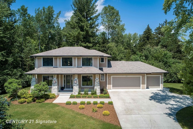2985 E Iron Woods Pass, Midland, MI 48642 - view of front of home with an attached garage, concrete driveway, covered porch, a front yard, and roof with shingles