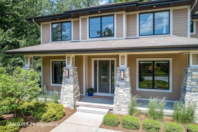 2985 E Iron Woods Pass, Midland, MI 48642 - view of front of property featuring a porch and roof with shingles