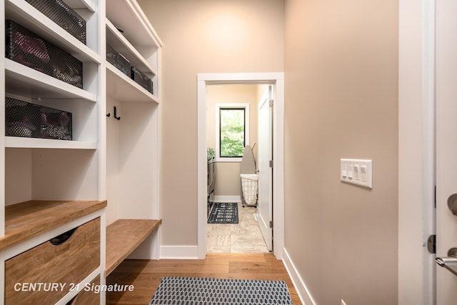2985 E Iron Woods Pass, Midland, MI 48642 - mudroom featuring wood finished floors and baseboards