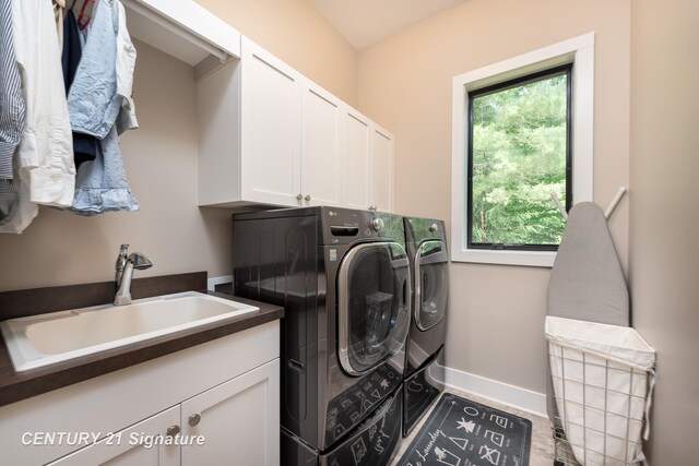 2985 E Iron Woods Pass, Midland, MI 48642 - washroom with washing machine and clothes dryer and cabinet space