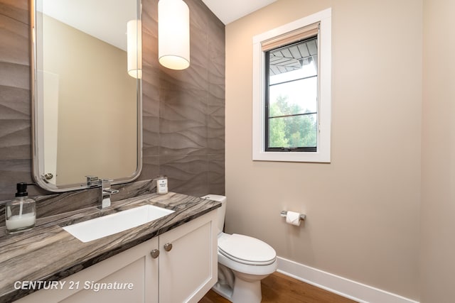 2985 E Iron Woods Pass, Midland, MI 48642 - half bath featuring vanity and wood finished floors
