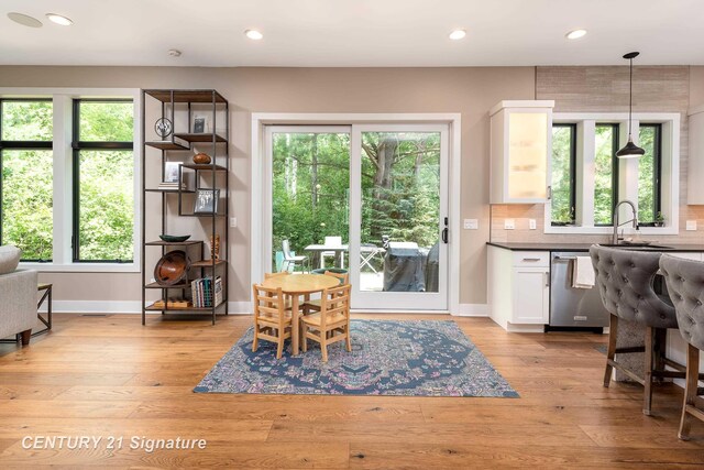 2985 E Iron Woods Pass, Midland, MI 48642 - dining room with recessed lighting and light wood finished floors