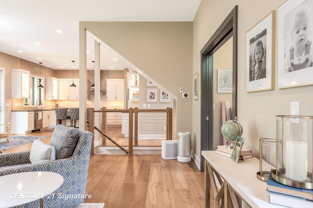 2985 E Iron Woods Pass, Midland, MI 48642 - living room with light wood-style flooring and recessed lighting