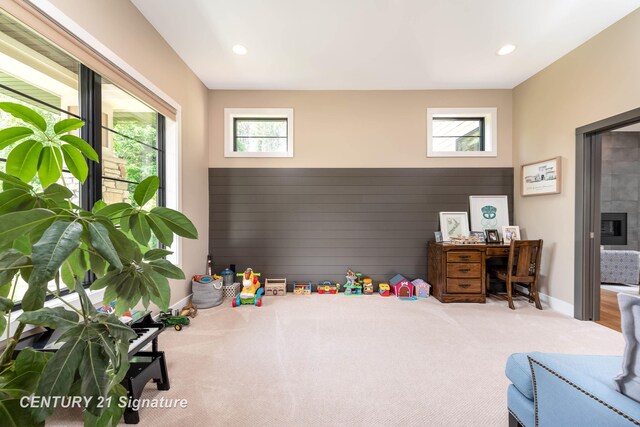 2985 E Iron Woods Pass, Midland, MI 48642 - recreation room featuring healthy amount of natural light, carpet floors, recessed lighting, wooden walls, and an office area