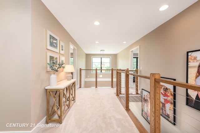 2985 E Iron Woods Pass, Midland, MI 48642 - corridor with an upstairs landing, recessed lighting, and light colored carpet