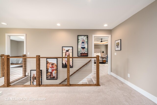 2985 E Iron Woods Pass, Midland, MI 48642 - hallway with an upstairs landing, carpet floors, and recessed lighting