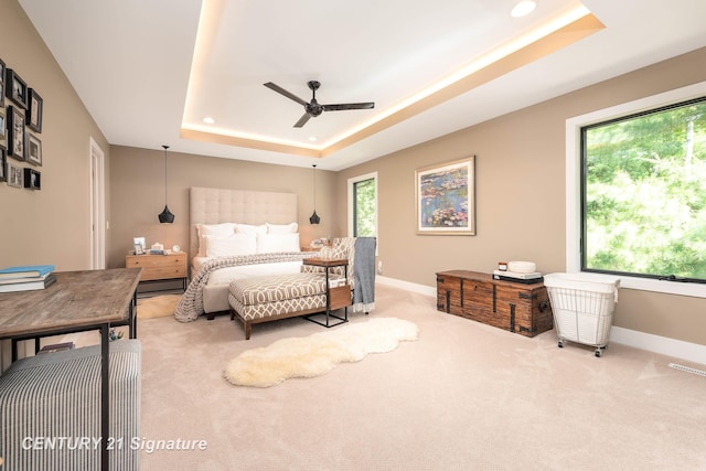 2985 E Iron Woods Pass, Midland, MI 48642 - carpeted bedroom featuring a tray ceiling, recessed lighting, and a ceiling fan
