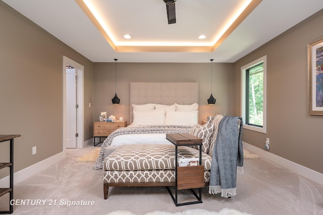 2985 E Iron Woods Pass, Midland, MI 48642 - carpeted bedroom with a tray ceiling and baseboards