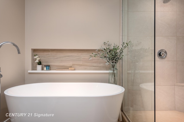 2985 E Iron Woods Pass, Midland, MI 48642 - full bathroom featuring a stall shower and a freestanding bath