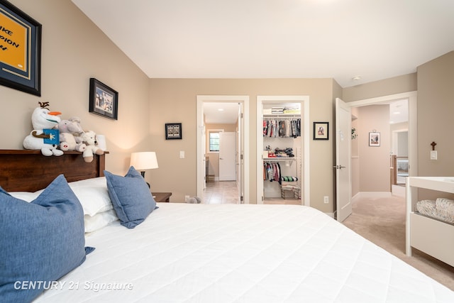 2985 E Iron Woods Pass, Midland, MI 48642 - bedroom with a walk in closet, a closet, and carpet