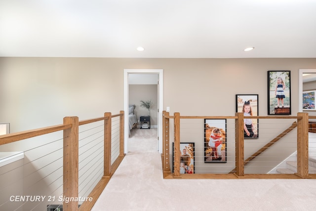 2985 E Iron Woods Pass, Midland, MI 48642 - hallway with an upstairs landing, carpet, and recessed lighting