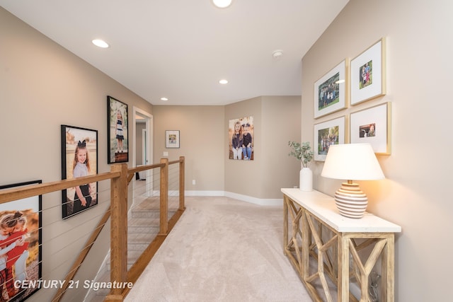 2985 E Iron Woods Pass, Midland, MI 48642 - hall with an upstairs landing, light colored carpet, and recessed lighting