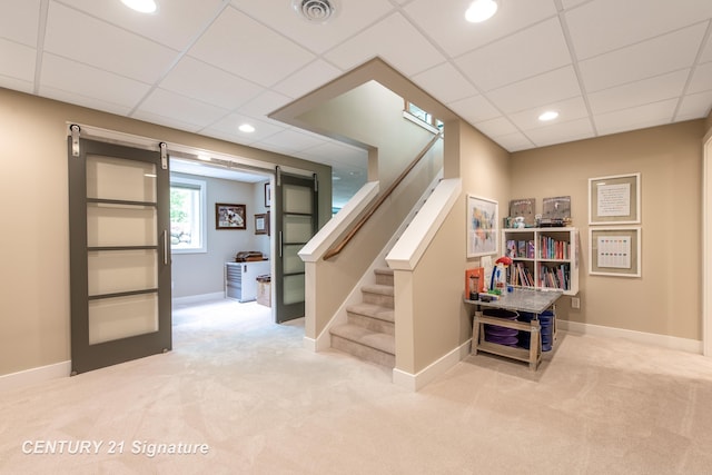 2985 E Iron Woods Pass, Midland, MI 48642 - stairway featuring carpet, a paneled ceiling, and recessed lighting