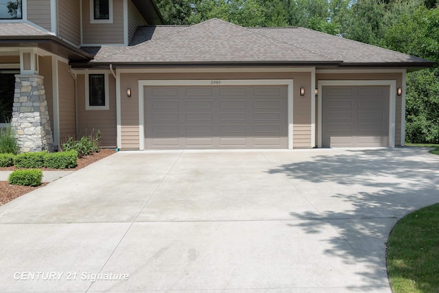 2985 E Iron Woods Pass, Midland, MI 48642 - garage featuring driveway
