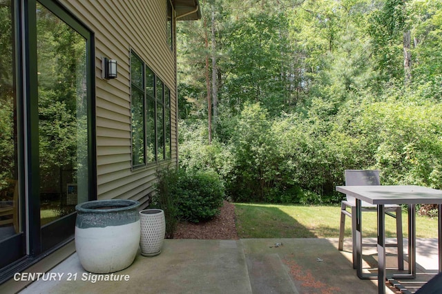 2985 E Iron Woods Pass, Midland, MI 48642 - view of patio / terrace with a view of trees