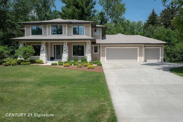 2985 E Iron Woods Pass, Midland, MI 48642 - prairie-style home featuring an attached garage, driveway, a front lawn, covered porch, and stone siding