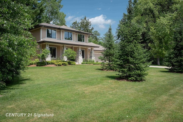 2985 E Iron Woods Pass, Midland, MI 48642 - view of front of home with a front yard, covered porch, and a garage