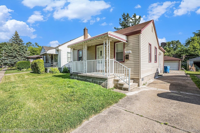 7034 Yacht Ave, Warren, MI 48091 - view of front of property with covered porch, a chimney, a detached garage, a front lawn, and an outbuilding