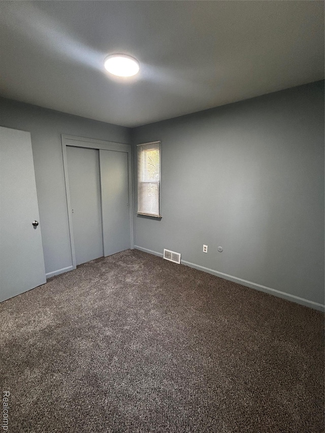 239 W Cornell Ave, Pontiac, MI 48340 - unfurnished bedroom with carpet floors and a closet