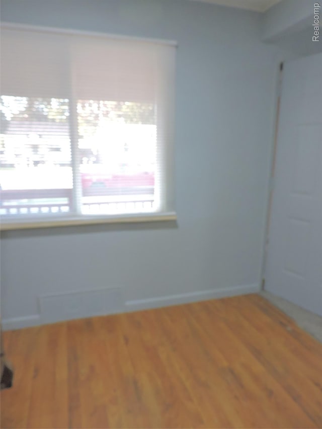 239 W Cornell Ave, Pontiac, MI 48340 - spare room featuring wood finished floors