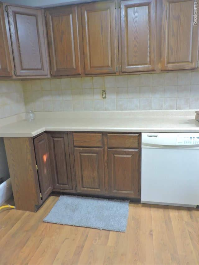 239 W Cornell Ave, Pontiac, MI 48340 - kitchen featuring dishwasher, light countertops, decorative backsplash, and light wood-type flooring