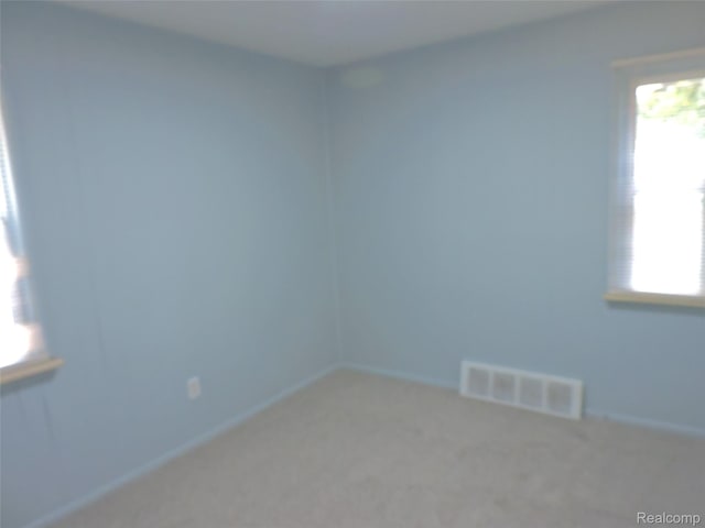 239 W Cornell Ave, Pontiac, MI 48340 - carpeted empty room with baseboards