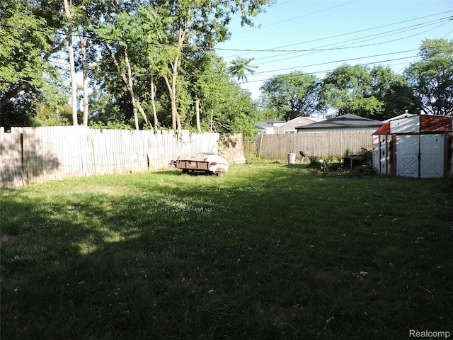 239 W Cornell Ave, Pontiac, MI 48340 - fenced backyard featuring a storage unit