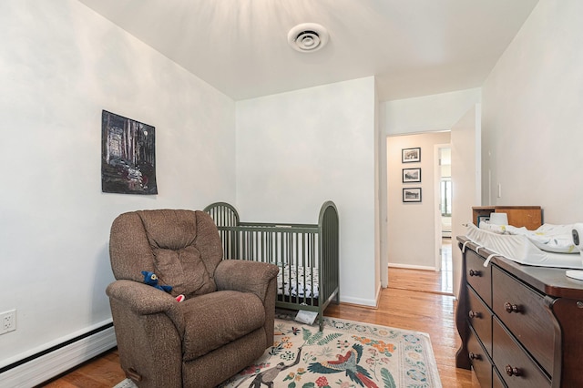 2507 Riverwood Ter, Saint Joseph, MI 49085 - living area with baseboard heating and light wood finished floors