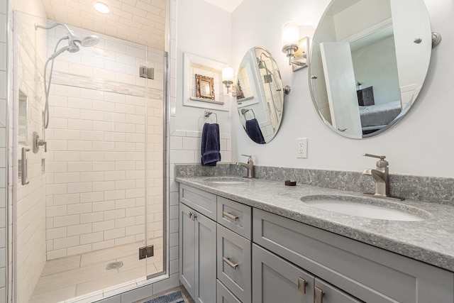2507 Riverwood Ter, Saint Joseph, MI 49085 - bathroom featuring a stall shower and double vanity