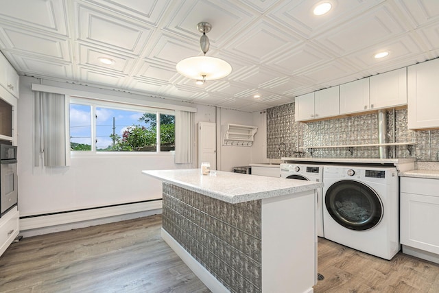 2507 Riverwood Ter, Saint Joseph, MI 49085 - washroom featuring washer / clothes dryer, an ornate ceiling, light wood finished floors, and recessed lighting