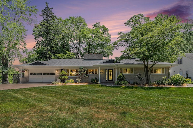 2507 Riverwood Ter, Saint Joseph, MI 49085 - ranch-style house with an attached garage, driveway, a yard, and a chimney