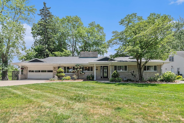 2507 Riverwood Ter, Saint Joseph, MI 49085 - ranch-style house featuring a garage, driveway, and a front lawn