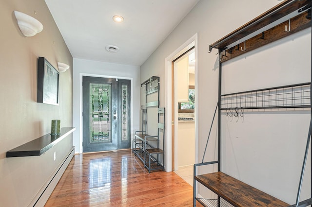 2507 Riverwood Ter, Saint Joseph, MI 49085 - entrance foyer with a baseboard heating unit, wood finished floors, and recessed lighting
