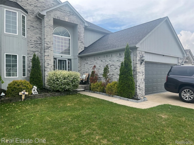 36339 Cecilia Dr, Sterling Heights, MI 48312 - view of property exterior featuring a garage, a yard, concrete driveway, and brick siding