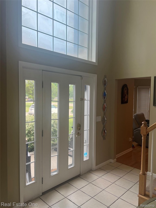 36339 Cecilia Dr, Sterling Heights, MI 48312 - foyer entrance with a towering ceiling, healthy amount of natural light, and light tile patterned flooring