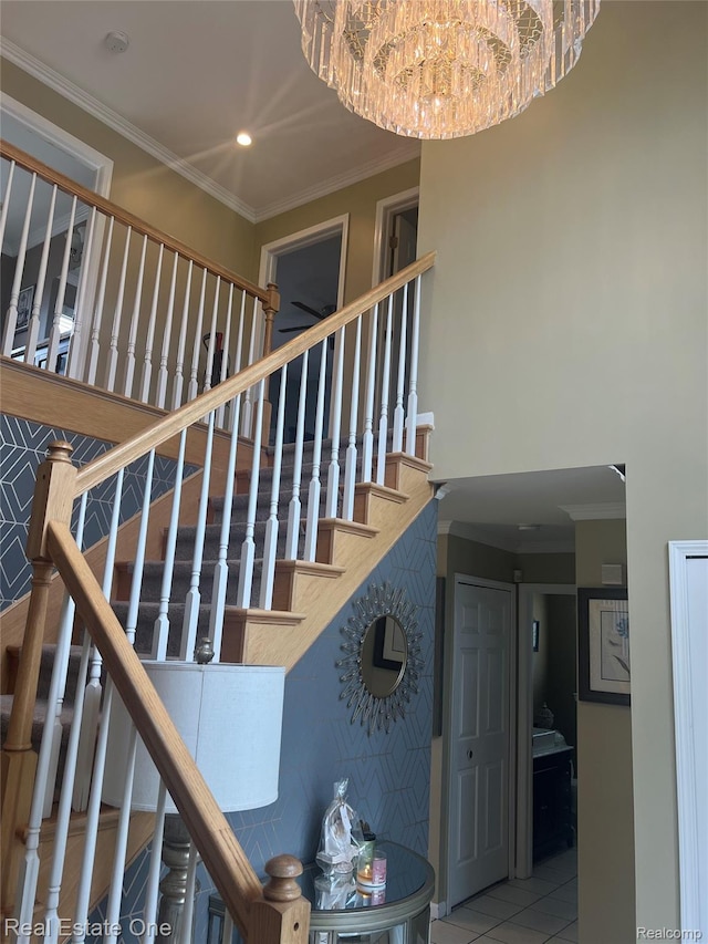 36339 Cecilia Dr, Sterling Heights, MI 48312 - staircase featuring ornamental molding, a chandelier, recessed lighting, and a towering ceiling