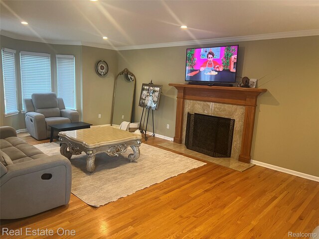 36339 Cecilia Dr, Sterling Heights, MI 48312 - living area with wood finished floors, a premium fireplace, recessed lighting, and ornamental molding