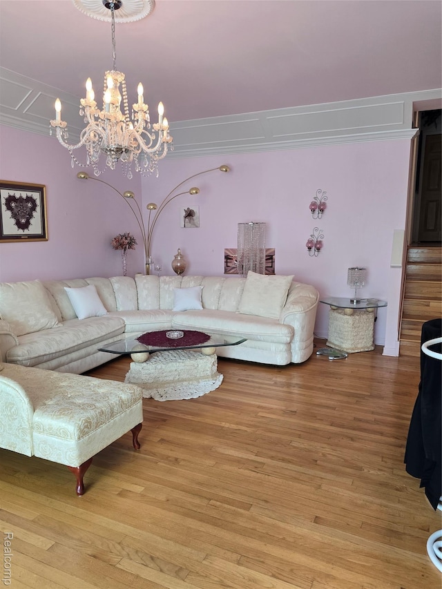 5605 Northcrest Xing, Clarkston, MI 48346 - living room featuring light wood-type flooring, a chandelier, and ornamental molding